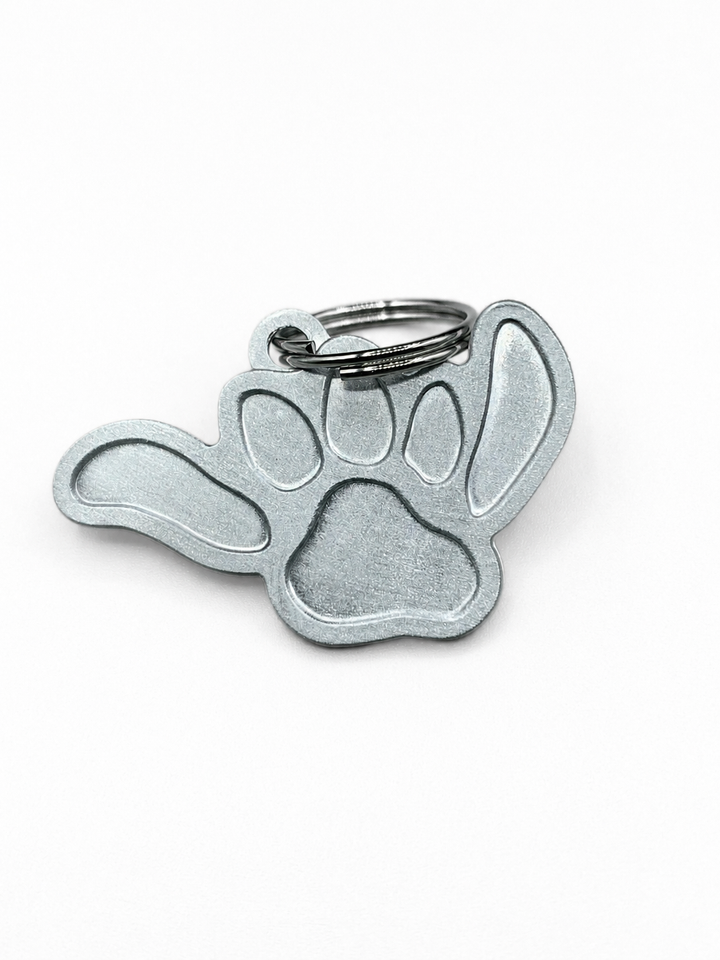 Salty Paws Shaka Paw dog ID tag front — engravable aluminum anti-loss tag